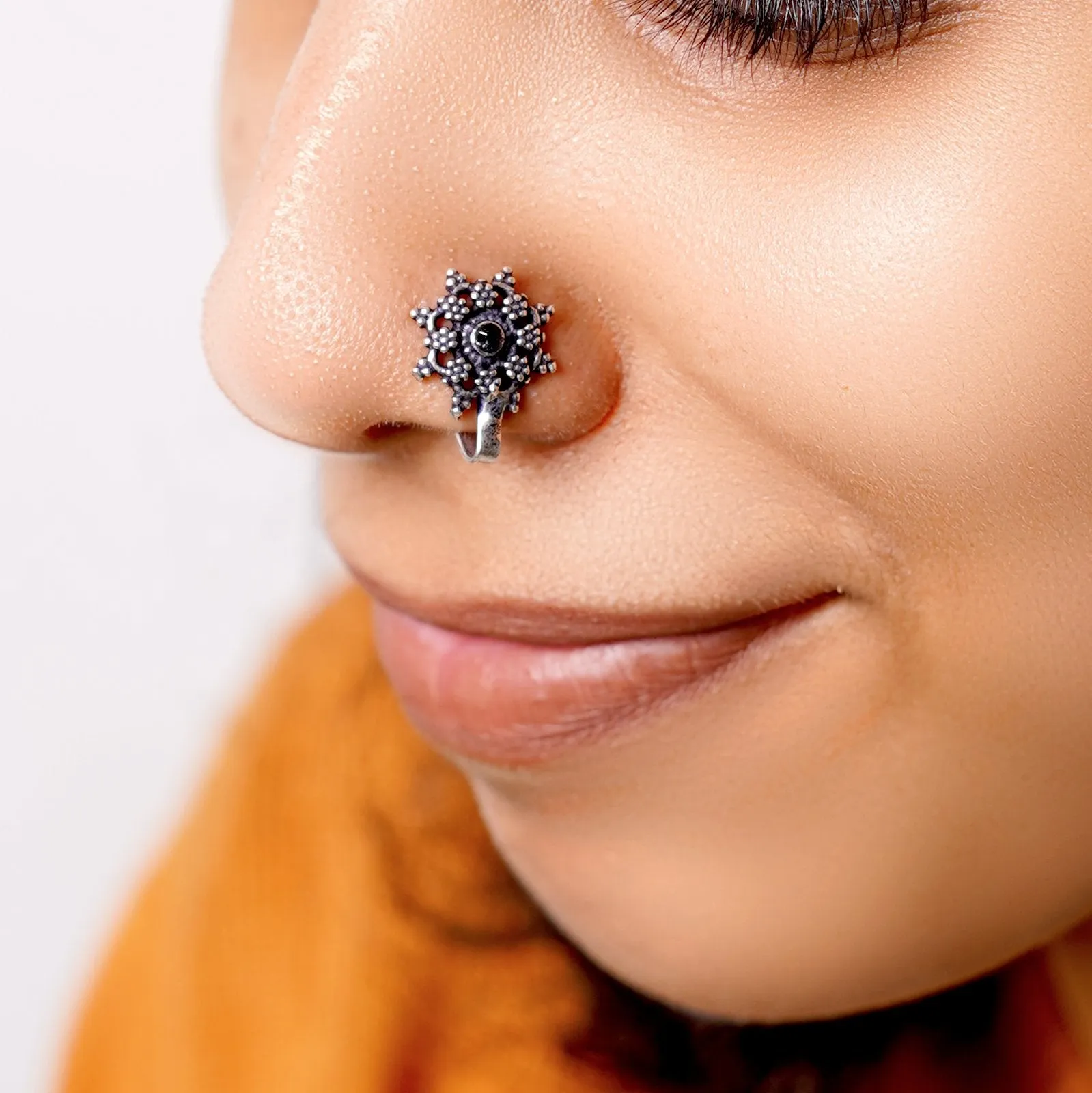 Gauri Black Stone Floral Nose pin